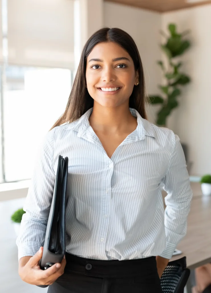 Woman holding a folder and smiling